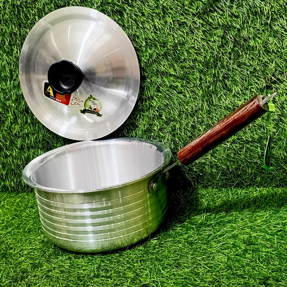 Stainless steel sauce pan on stove with handle