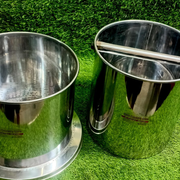 Durable professional-grade stainless steel milk can with sturdy handle on green grass background